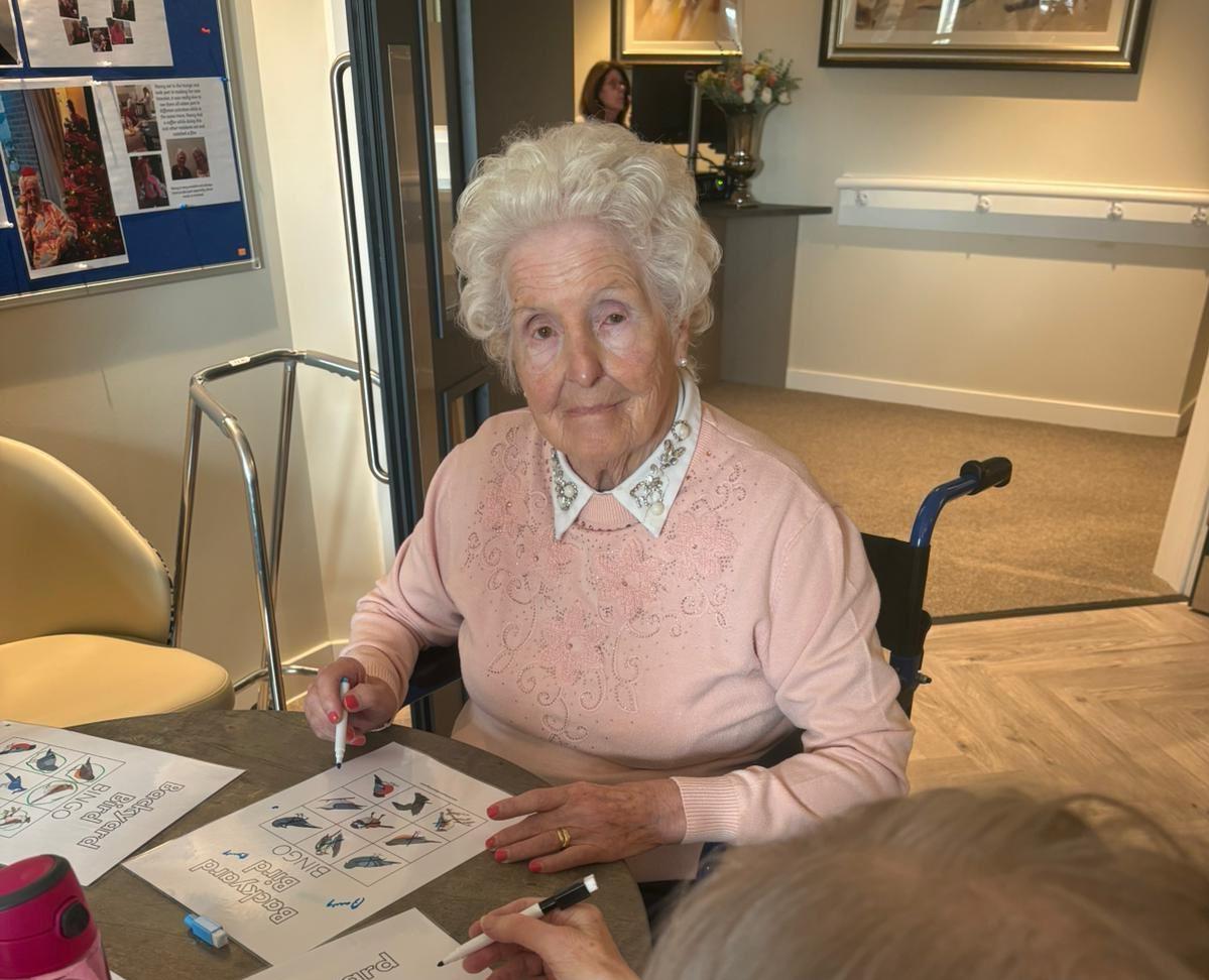 elderly woman playing bingo