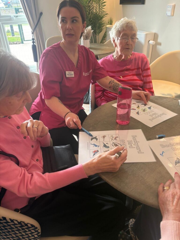 care home residents and staff playing bingo