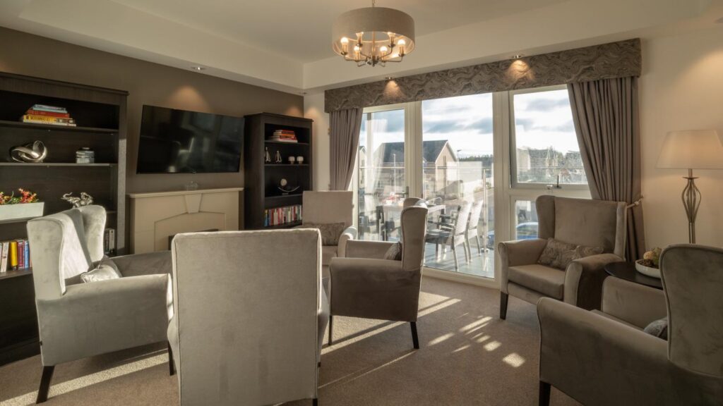care home lounge with sofas and armchairs