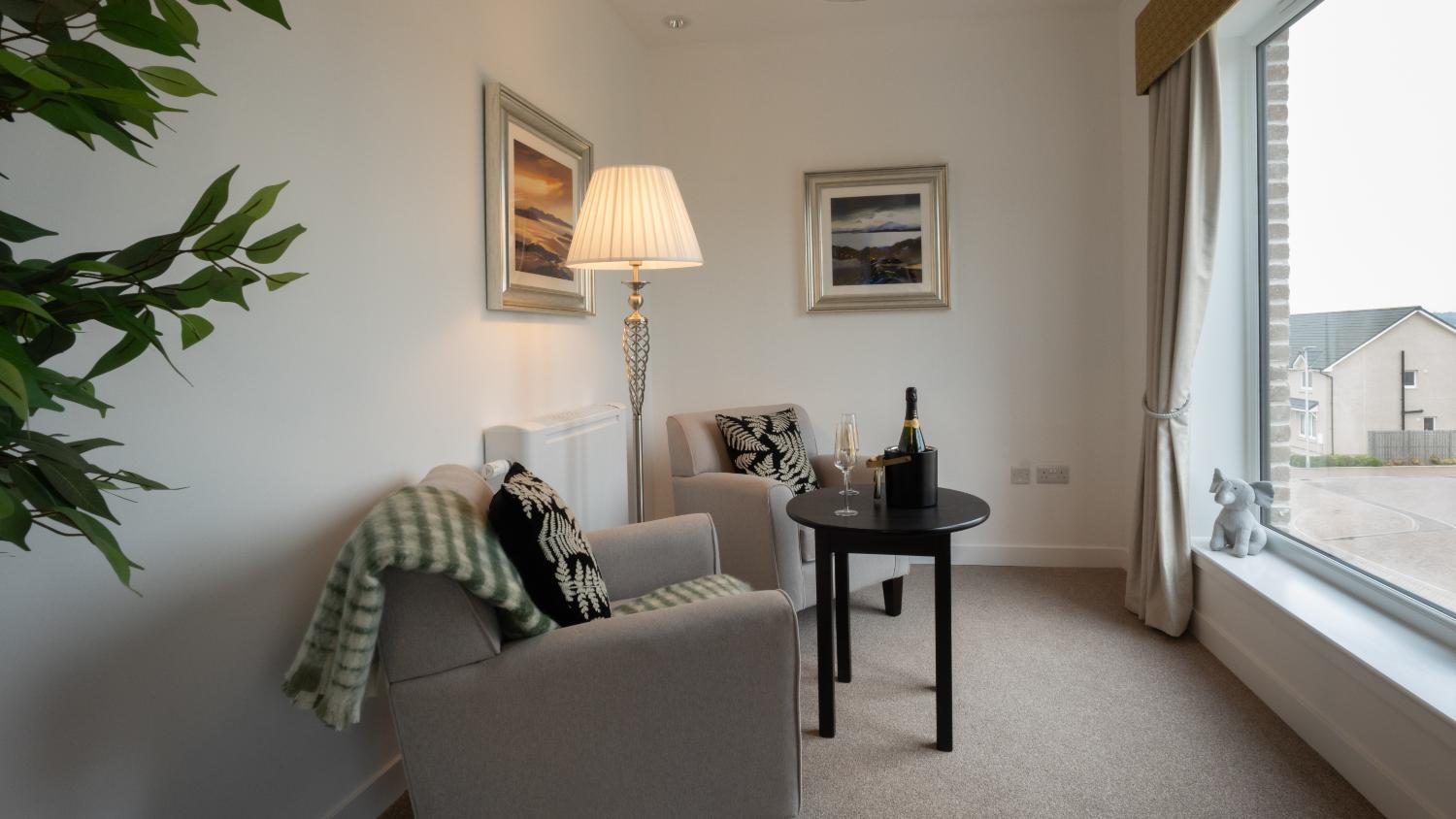 viewing window with armchairs looking out over Edinburgh