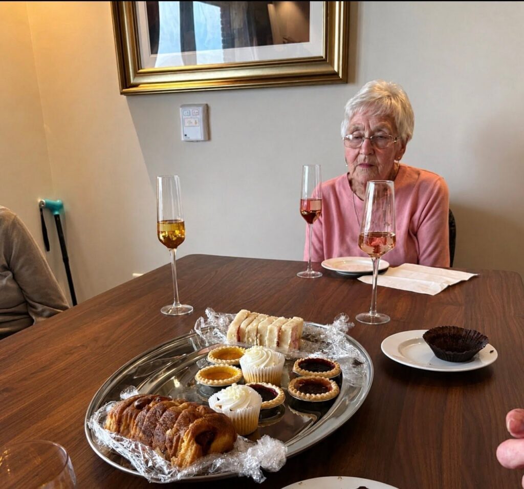 older lady sat at a table