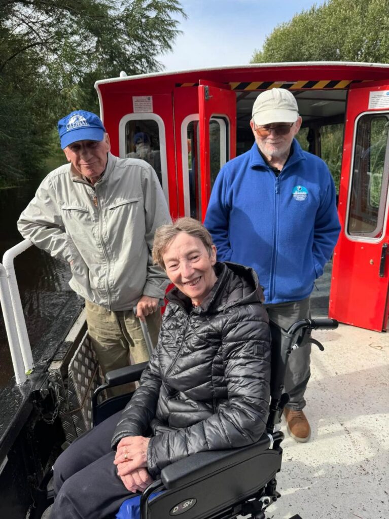 residents smiling on a boat